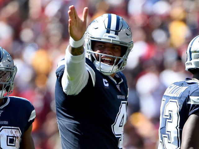LANDOVER, MD - SEPTEMBER 15: Dak Prescott #4 of the Dallas Cowboys celebrates a first down against the Washington Redskins during the first half at FedExField on September 15, 2019 in Landover, Maryland.