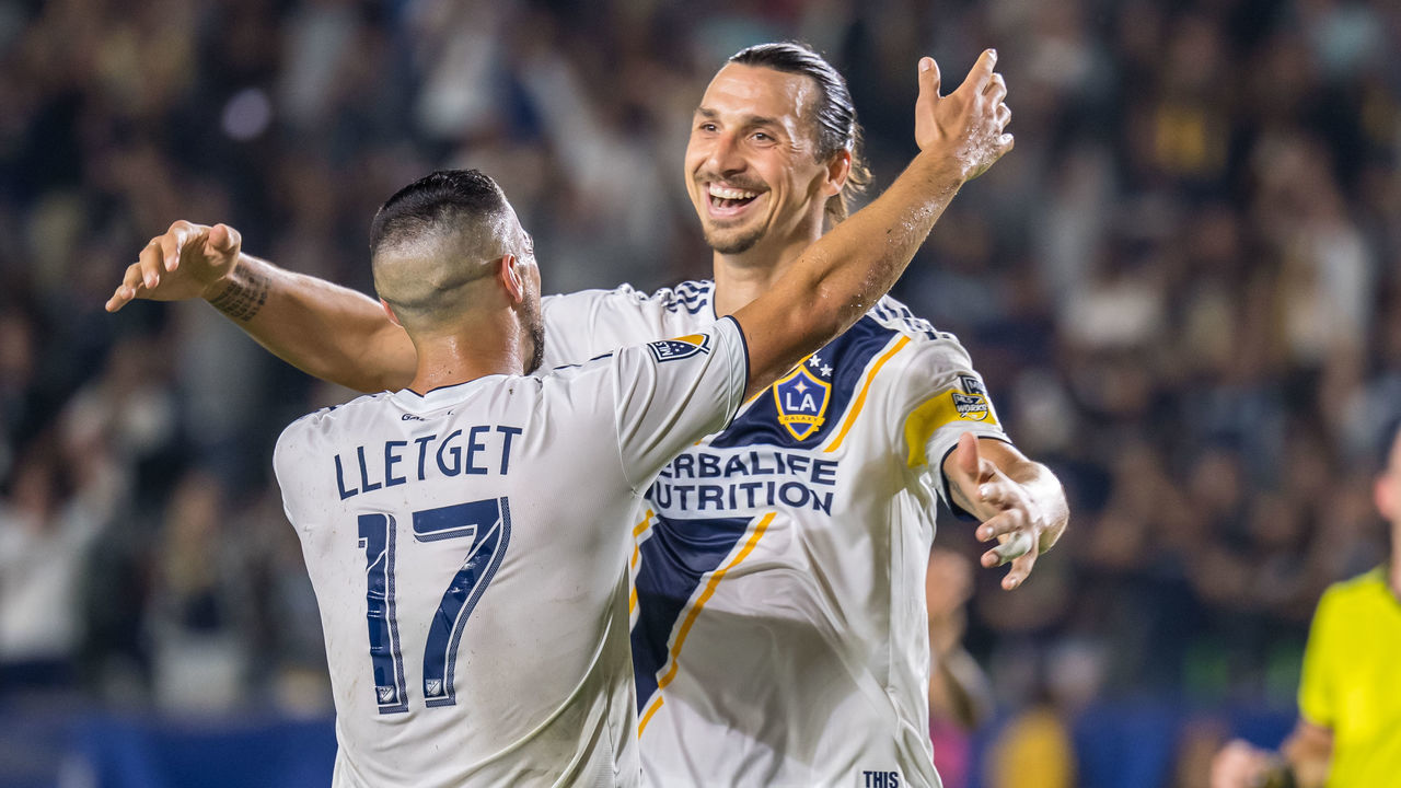 CARSON, CA -SEPTEMBER 15: Sebastian Lletget #17 of Los Angeles Galaxy celebrates his first goal with Zlatan Ibrahimovic #9 of Los Angeles Galaxy during the Los Angeles Galaxy's MLS match against Sporting KC at the Dignity Health Sports Park on September 15, 2019 in Carson, California. Los Angeles Galaxy won the match 7-2