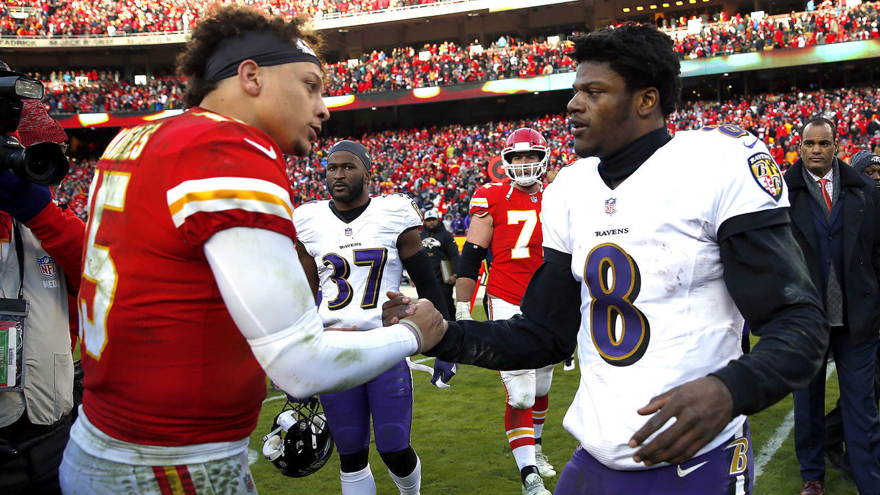 KANSAS CITY, MISSOURI - DECEMBER 09: Quarterback Patrick Mahomes #15 of the Kansas City Chiefs shakes hands with quarterback Lamar Jackson #8 of the Baltimore Ravens after the Chiefs defeated the Ravens 27-24 in overtime to win the game at Arrowhead Stadium on December 09, 2018 in Kansas City, Missouri.