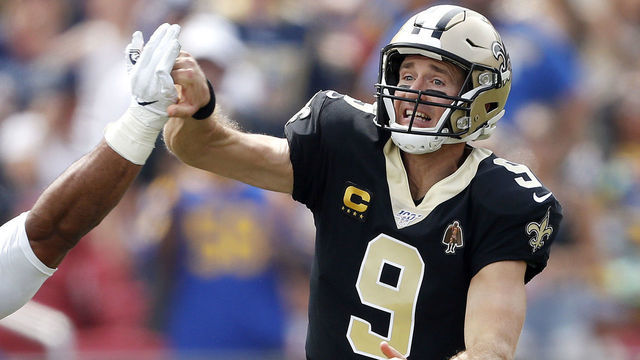 LOS ANGELES, CALIFORNIA - SEPTEMBER 15: Drew Brees #9 of the New Orleans Saints injures his throwing hand as he is hit by Aaron Donald #99 of the Los Angeles Rams during the first quarter in the game at Los Angeles Memorial Coliseum on September 15, 2019 in Los Angeles, California.