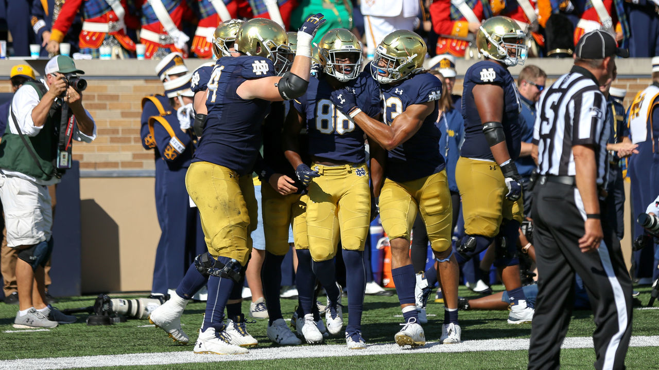 SOUTH BEND, IN - SEPTEMBER 14: Notre Dame Fighting Irish wide receiver Javon McKinley (88) is congratulated by teammates after scoring on a 65-yard pass play during the second quarter of the college football game between the New Mexico Lobos and the Notre Dame Fighting Irish on September 14, 2019, at Notre Dame Stadium in South Bend, IN.