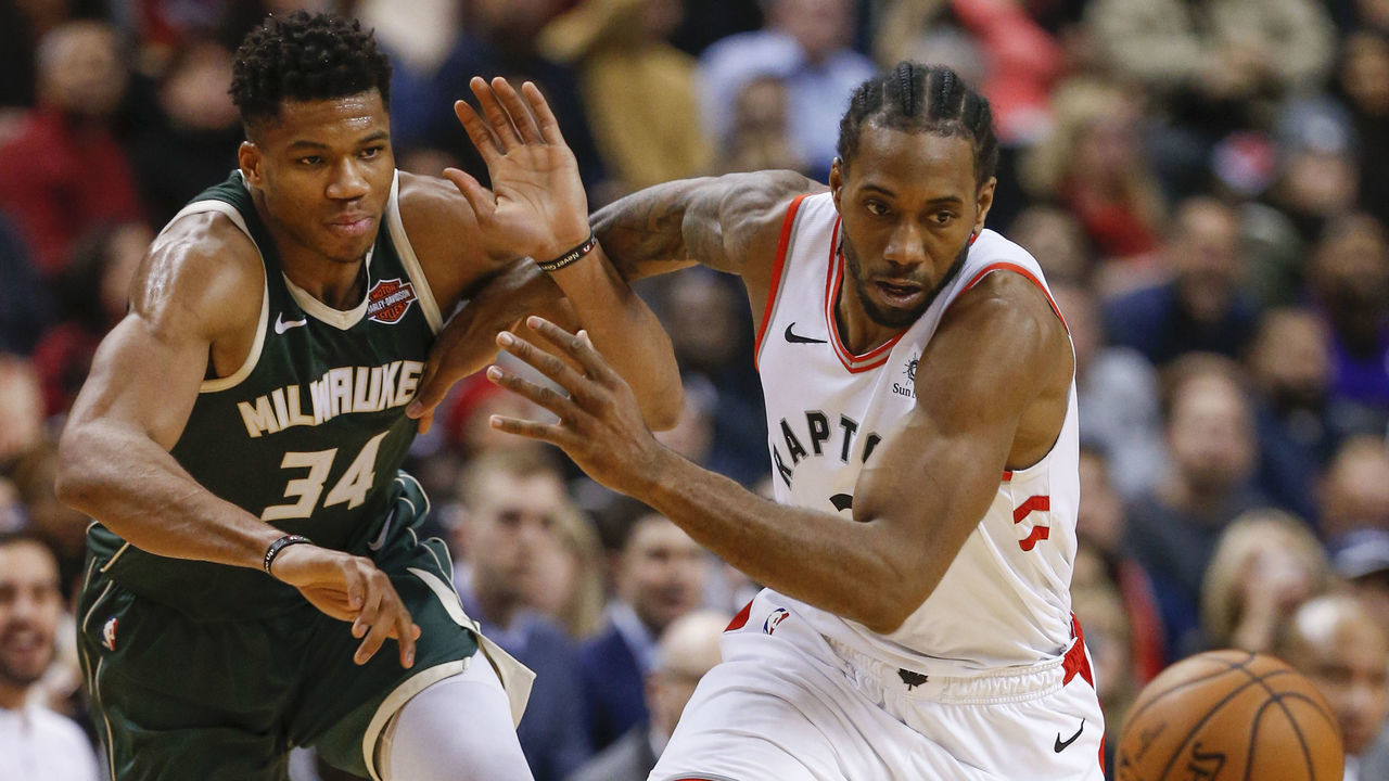 TORONTO, ON - DECEMBER 9: Toronto Raptors forward Kawhi Leonard (2) with nice defence to deflect the ball away from Milwaukee Bucks forward Giannis Antetokounmpo (34) and chase it down for a turnover. Toronto Raptors vs Milwaukee Bucks in 2nd half action of NBA regular season play at Scobiabank Arena. Raptors lose 99-104. Toronto Star/Rick Madonik (Rick Madonik/Toronto Star via Getty Images)