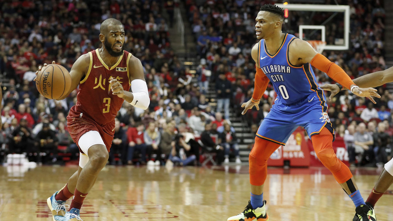 HOUSTON, TX - FEBRUARY 09: Chris Paul #3 of the Houston Rockets drives to the basket defended by Russell Westbrook #0 of the Oklahoma City Thunder in the first half at Toyota Center on February 9, 2019 in Houston, Texas.