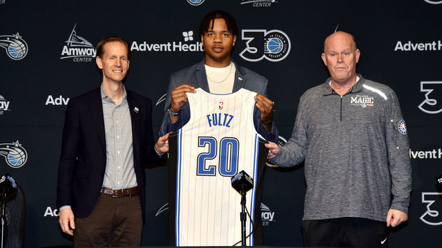 ORLANDO, FL - FEBRUARY 14: Jeff Weltman, Markelle Fultz and Head Coach Steve Clifford poses for a photo during the press conference on February 14, 2019 at Amway Center in Orlando, Florida. Mandatory Copyright Notice: Copyright 2019 NBAE