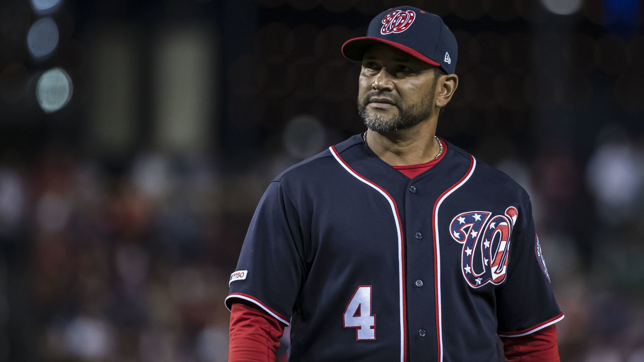 WASHINGTON, DC - SEPTEMBER 13: Dave Martinez #4 of the Washington Nationals walks to the dugout against the Atlanta Braves during the eighth inning at Nationals Park on September 13, 2019 in Washington, DC.