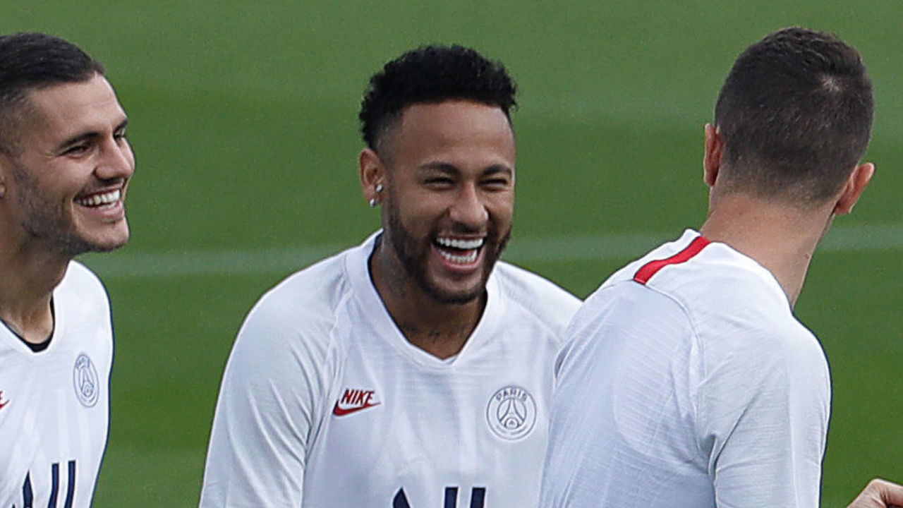 Paris Saint-Germain's Brazilian forward Neymar (C) and Paris Saint-Germain's Argentine forward Mauro Icardi (L) joke with a teammate during a training session at the club's Camp des Loges training grounds in Saint-Germain-en-Laye, west of Paris on September 17, 2019 on the eve of their UEFA Champions League Group A football match Paris Saint-Germain and Real Madrid CF.