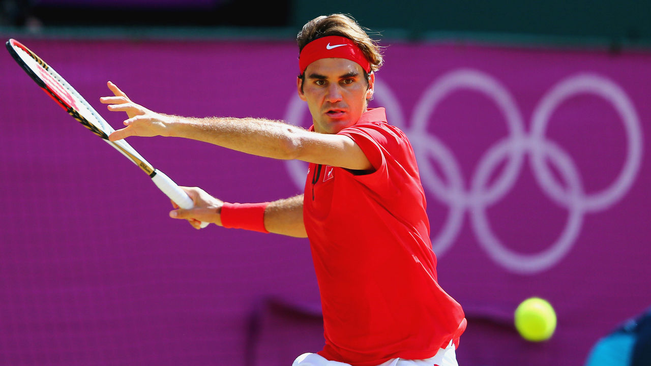 LONDON, ENGLAND - AUGUST 05: Roger Federer of Switzerland plays a shot against Andy Murray of Great Britain during the Men's Singles Tennis Gold Medal Match against Andy Murray of Great Britain on Day 9 of the London 2012 Olympic Games, at the All England Lawn Tennis and Croquet Club on August 5, 2012 in London, England.