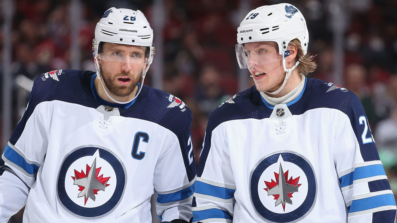 GLENDALE, ARIZONA - FEBRUARY 24: Blake Wheeler #26 and Patrik Laine #29 of the Winnipeg Jets skate up to a face-off against the Arizona Coyotes during the third period of the NHL game at Gila River Arena on February 24, 2019 in Glendale, Arizona. The Coyotes defeated the Jets 4-1.