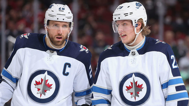 GLENDALE, ARIZONA - FEBRUARY 24: Blake Wheeler #26 and Patrik Laine #29 of the Winnipeg Jets skate up to a face-off against the Arizona Coyotes during the third period of the NHL game at Gila River Arena on February 24, 2019 in Glendale, Arizona. The Coyotes defeated the Jets 4-1.