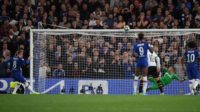 Chelsea's English midfielder Ross Barkley (L) hits a penalty over the bar during the UEFA Champion's League Group H football match between Chelsea and Valencia at Stamford Bridge in London on September 17, 2019.