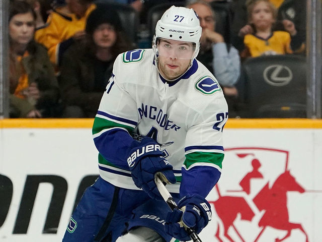NASHVILLE, TN - APRIL 4: Ben Hutton #27 of the Vancouver Canucks skates against the Nashville Predators at Bridgestone Arena on April 4, 2019 in Nashville, Tennessee.