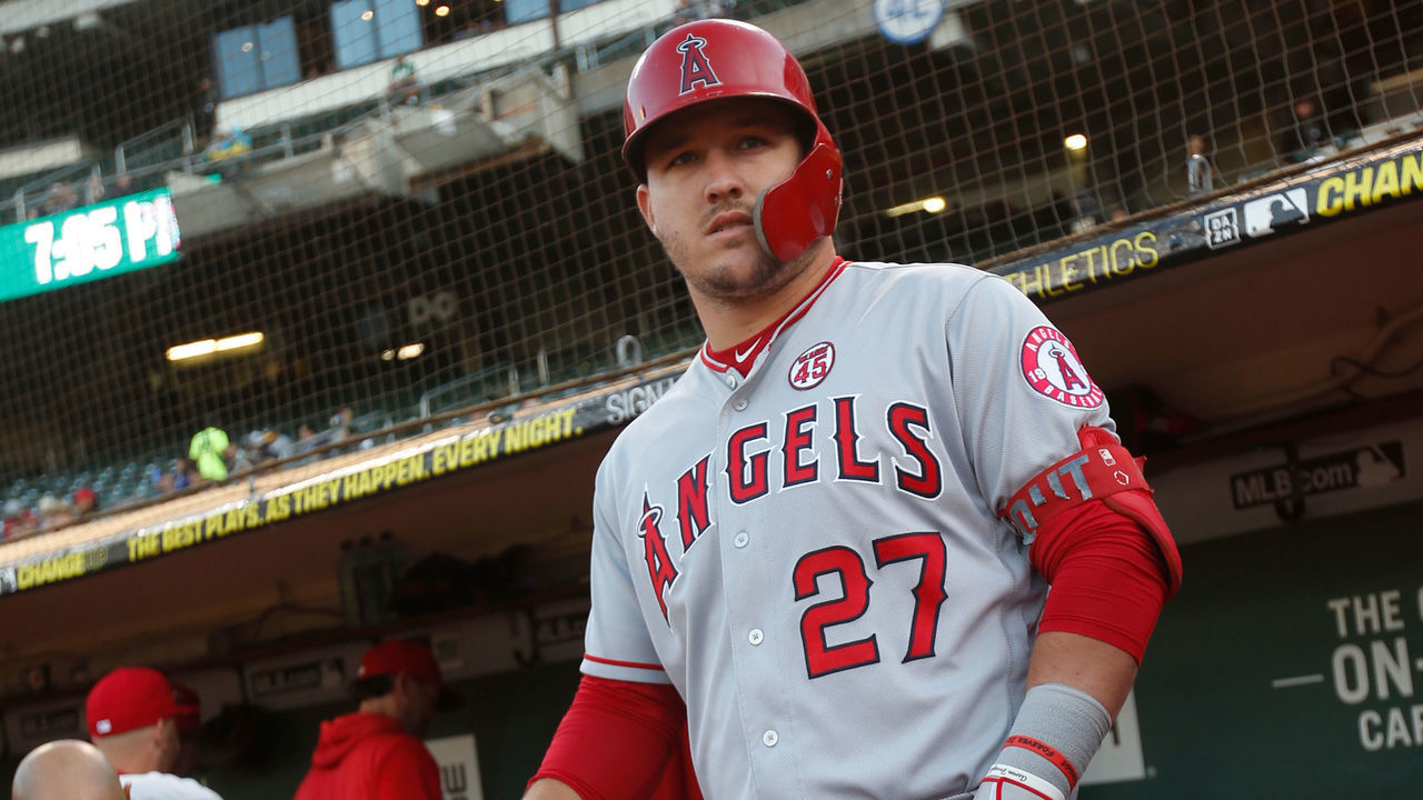 OAKLAND, CA - SEPTEMBER 4: Mike Trout #27 of the Los Angeles Angels of Anaheim stands in the dugout prior to the game against the Oakland Athletics at the Oakland-Alameda County Coliseum on September 4, 2019 in Oakland, California. The Athletics defeated the Angels 4-0.