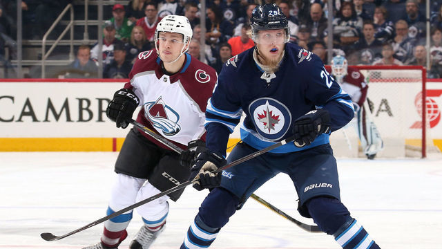 WINNIPEG, MB - FEBRUARY 16: Mikko Rantanen #96 of the Colorado Avalanche and Patrik Laine #29 of the Winnipeg Jets follow the play down the ice during first period action at the Bell MTS Place on February 16, 2018 in Winnipeg, Manitoba, Canada.