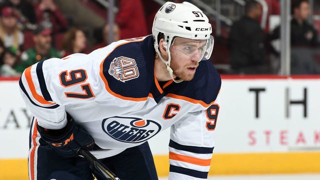 GLENDALE, AZ - MARCH 16: Connor McDavid #97 of the Edmonton Oilers gets ready during a faceoff against the Arizona Coyotes at Gila River Arena on March 16, 2019 in Glendale, Arizona.