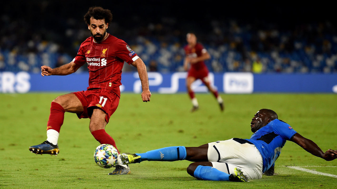 NAPLES, ITALY - SEPTEMBER 17: (THE SUN OUT, THE SUN ON SUNDAY OUT) Mohamed Salah of Liverpool with Kalidou Koulibaly of SSC Napoli during the UEFA Champions League group E match between SSC Napoli and Liverpool FC at Stadio San Paolo on September 17, 2019 in Naples, Italy.