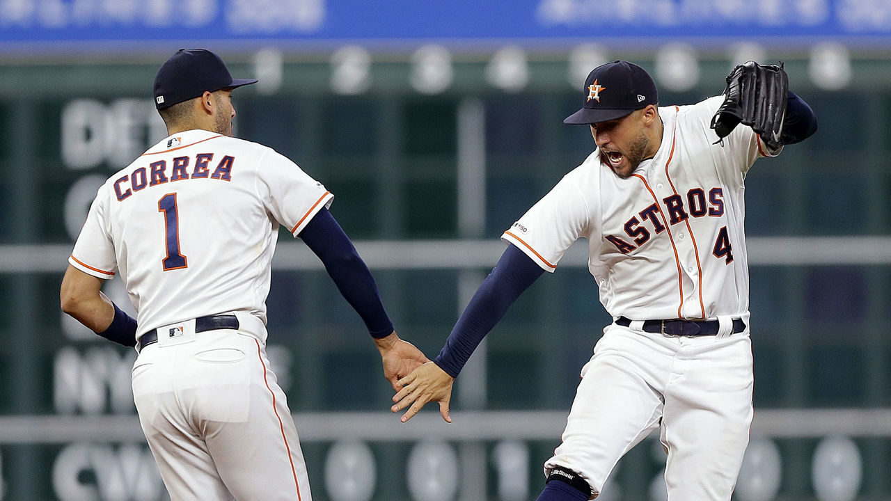 HOUSTON, TEXAS - SEPTEMBER 17: Carlos Correa #1 of the Houston Astros and George Springer #4 celebrate after the final out against the Texas Rangers at Minute Maid Park on September 17, 2019 in Houston, Texas.