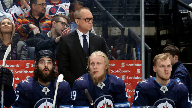WINNIPEG, MB - MARCH 23: Head Coach Paul Maurice, Mathieu Perreault #85, Patrik Laine #29 and Nikolaj Ehlers #27 of the Winnipeg Jets look on from the bench prior to puck drop against the Anaheim Ducks at the Bell MTS Place on March 23, 2018 in Winnipeg, Manitoba, Canada.