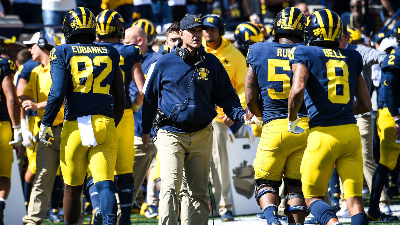 ANN ARBOR, MI - SEPTEMBER 07: Michigan Wolverines head coach congratulates his offense during the Michigan Wolverines versus Army Black Knights game on Saturday September 7, 2019 at Michigan Stadium in Ann Arbor, MI.