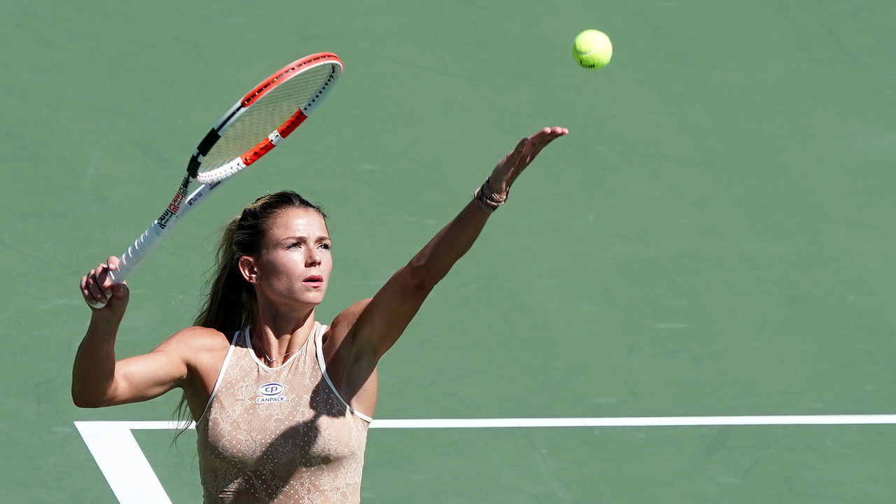 OSAKA, JAPAN - SEPTEMBER 19: Camila Giorgi of Italy serves against Sloane Stephens of the United States during day four of the Toray Pan Pacific Open at Utsubo Tennis Cent on September 19, 2019 in Osaka, Japan.