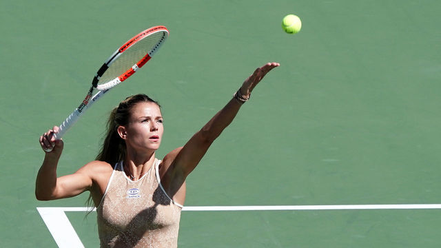 OSAKA, JAPAN - SEPTEMBER 19: Camila Giorgi of Italy serves against Sloane Stephens of the United States during day four of the Toray Pan Pacific Open at Utsubo Tennis Cent on September 19, 2019 in Osaka, Japan.