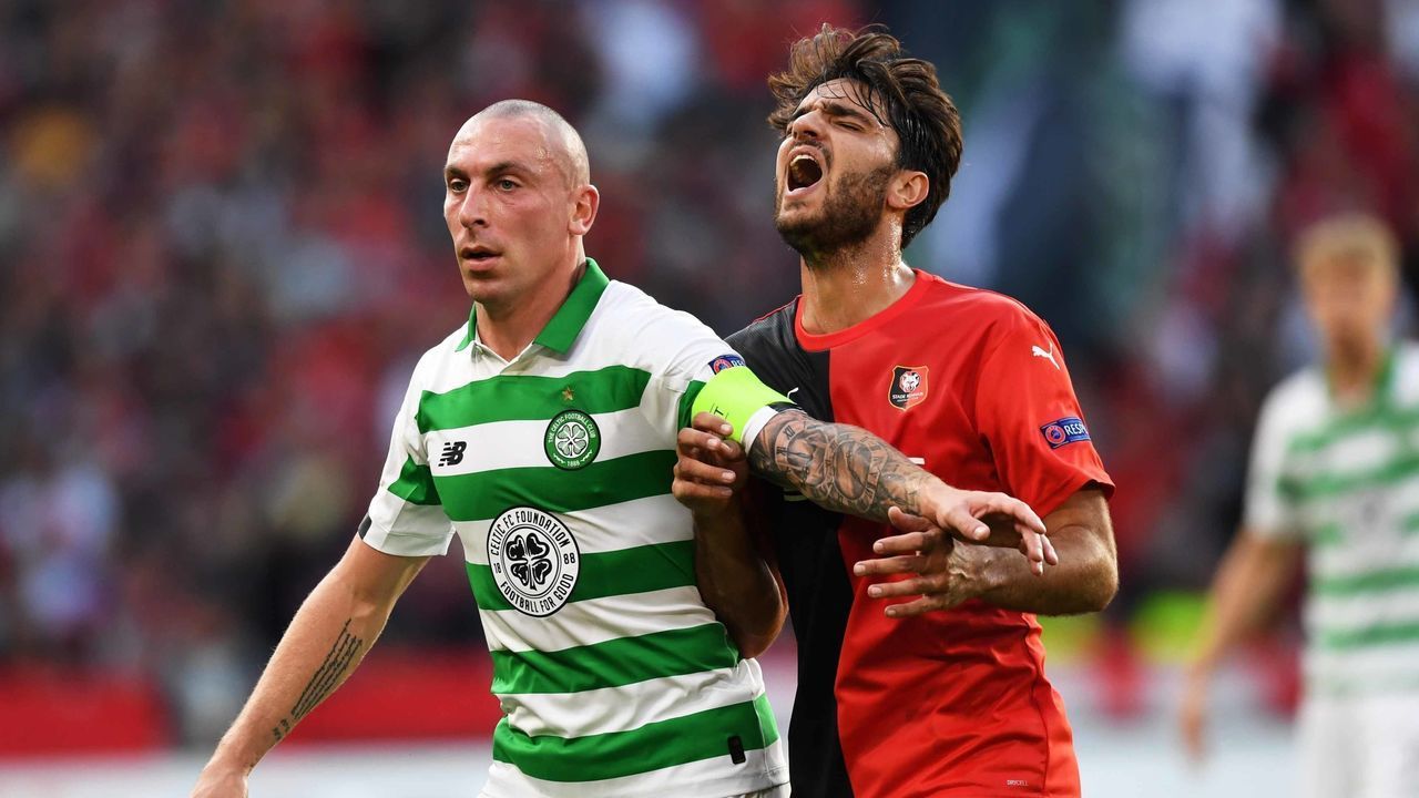 RENNES, FRANCE - SEPTEMBER 19: Celtic's Scott Brown (L) in action with Stade Rennais' Clement Grenier during the UEFA Europa League Group E match between Stade Rennais and Celtic at Roazhon Park, on September 19, in Rennes, France