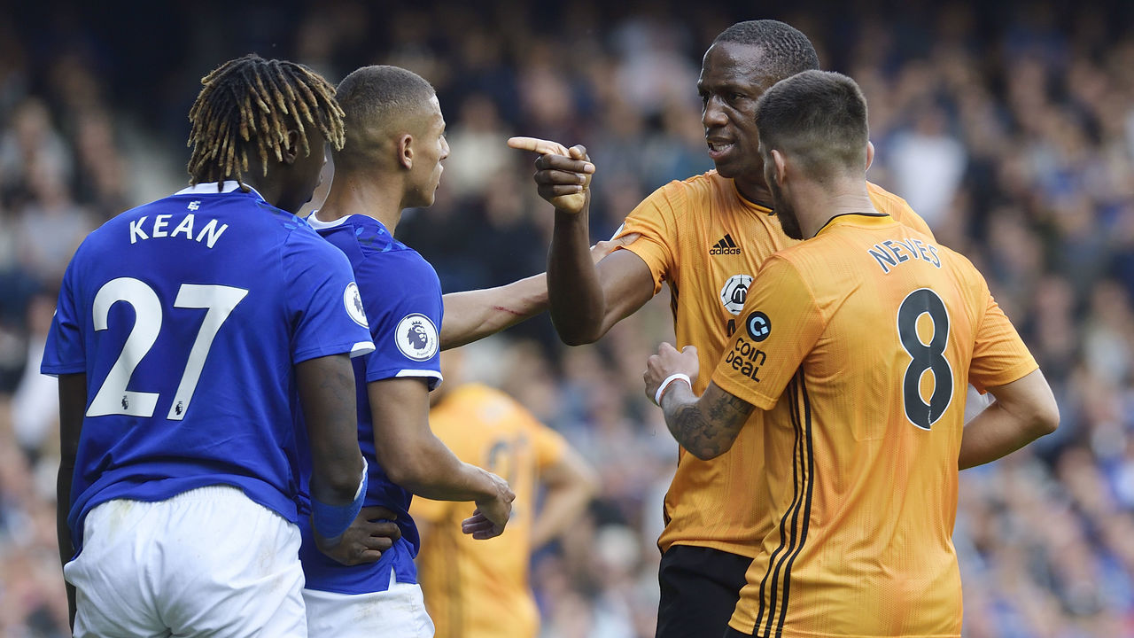 LIVERPOOL, ENGLAND - SEPTEMBER 1: Willy Boly of Wolverhampton Wanderers makes a point to Richarlison and Moise Kean of Everton during the Premier League match between Everton and Wolverhampton Wanderers at Goodison Park on September 1, 2019 in Liverpool, England.