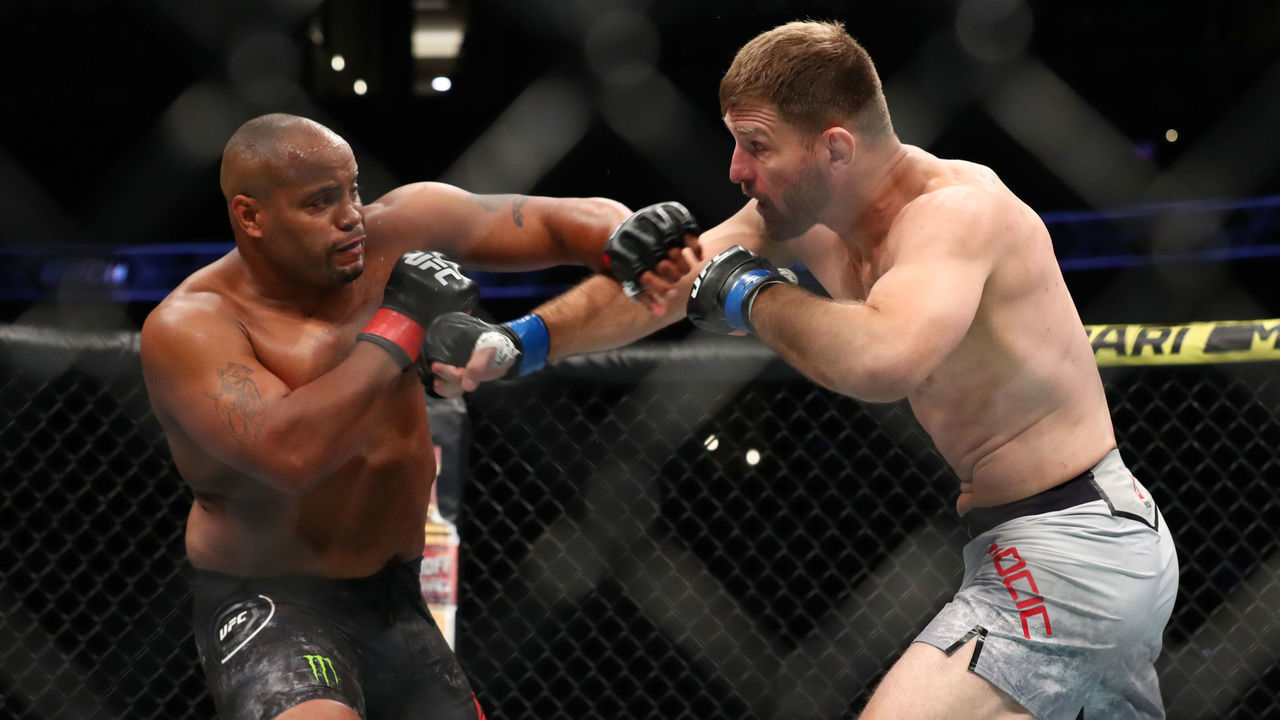 ANAHEIM, CALIFORNIA - AUGUST 17: Daniel Cormier throws a punch at Stipe Miocic in the first round during their UFC Heavyweight Title Bout at UFC 241 at Honda Center on August 17, 2019 in Anaheim, California.