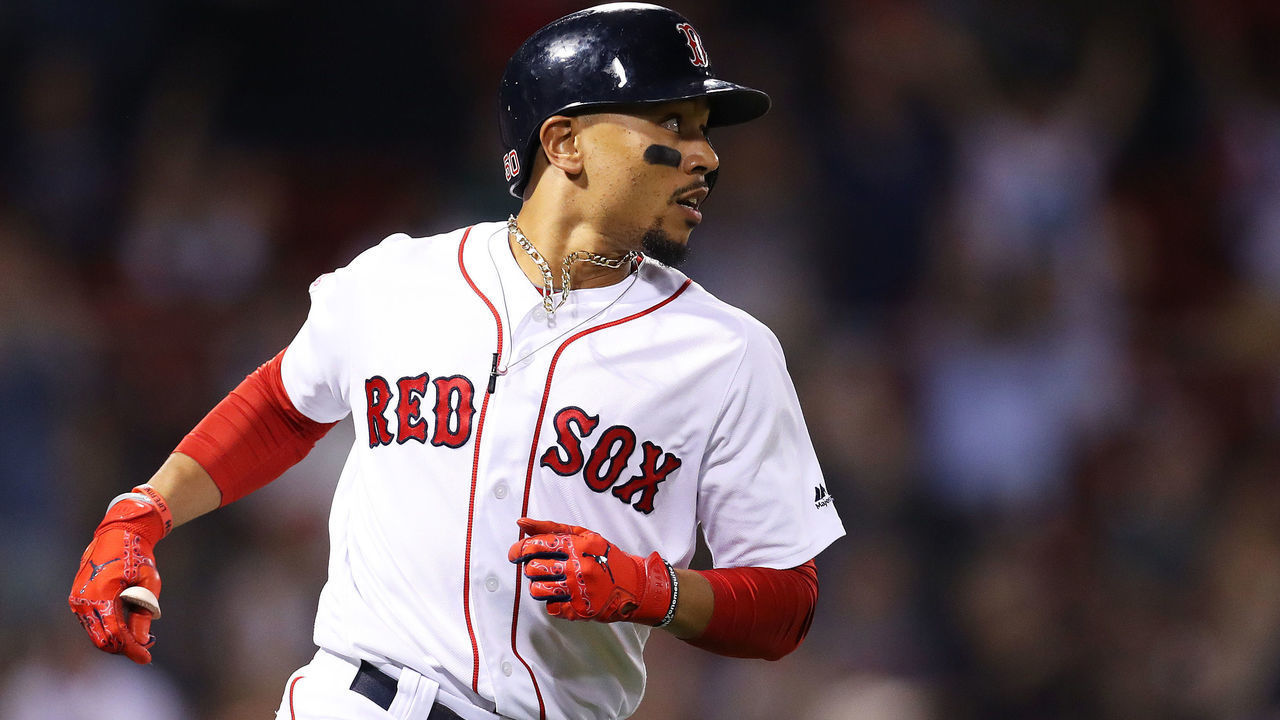 BOSTON, MASSACHUSETTS - SEPTEMBER 04: Mookie Betts #50 of the Boston Red Sox rounds the bases after hitting a three run home run against the Minnesota Twins during the second inning at Fenway Park on September 04, 2019 in Boston, Massachusetts.