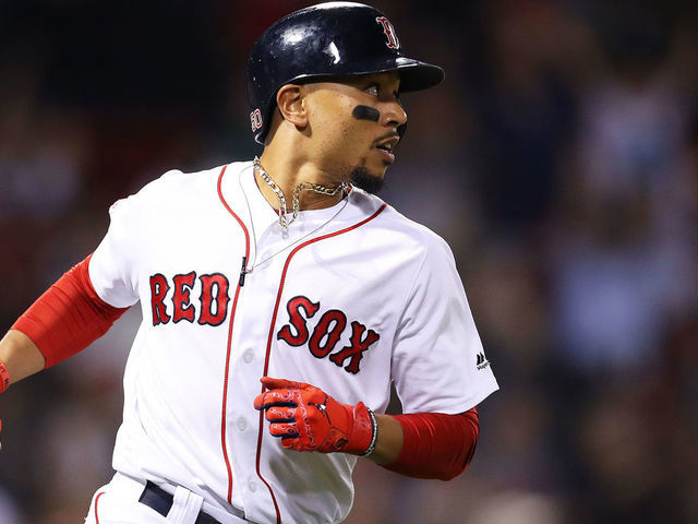 BOSTON, MASSACHUSETTS - SEPTEMBER 04: Mookie Betts #50 of the Boston Red Sox rounds the bases after hitting a three run home run against the Minnesota Twins during the second inning at Fenway Park on September 04, 2019 in Boston, Massachusetts.