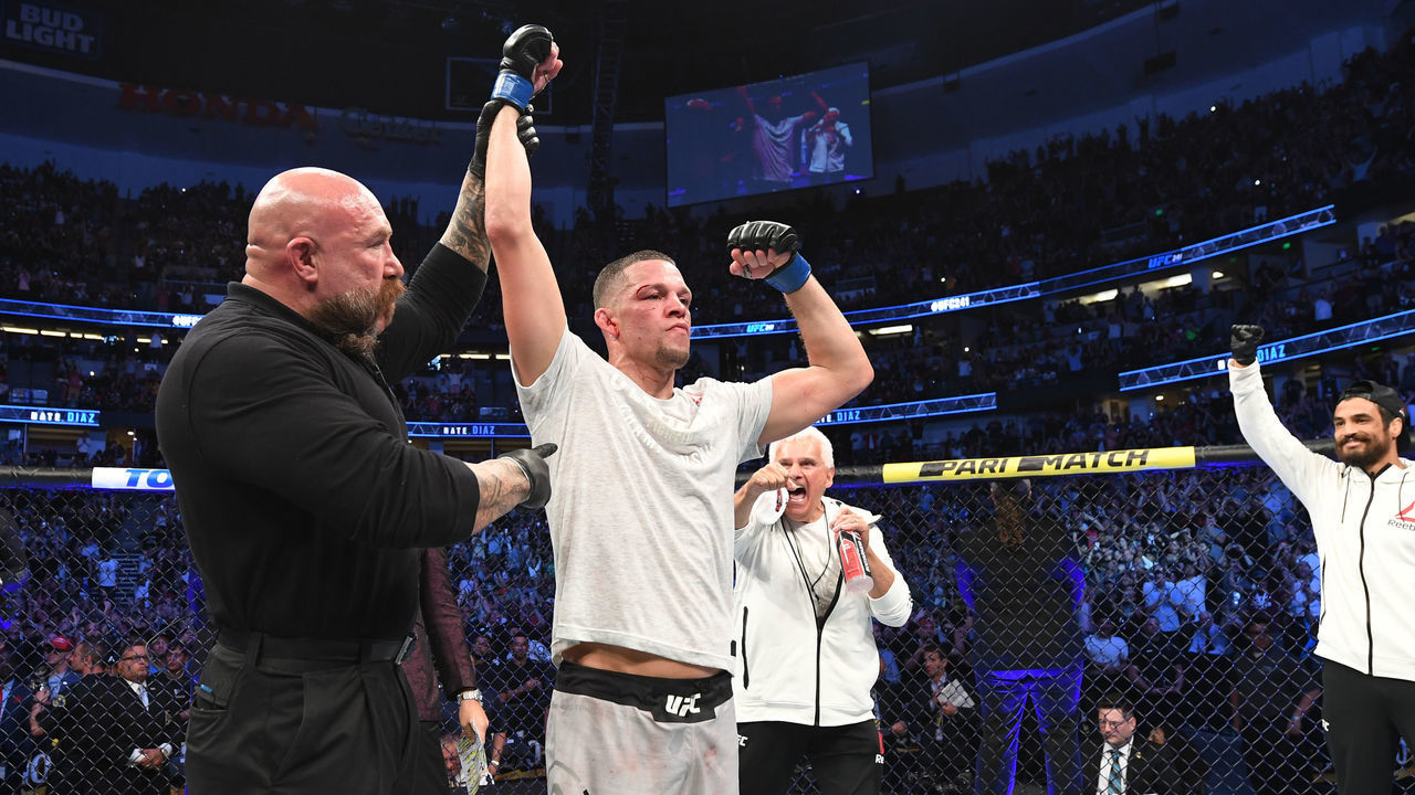 ANAHEIM, CALIFORNIA - AUGUST 17: Nate Diaz celebrates his victory over Anthony Pettis in their welterweight bout during the UFC 241 event at the Honda Center on August 17, 2019 in Anaheim, California.