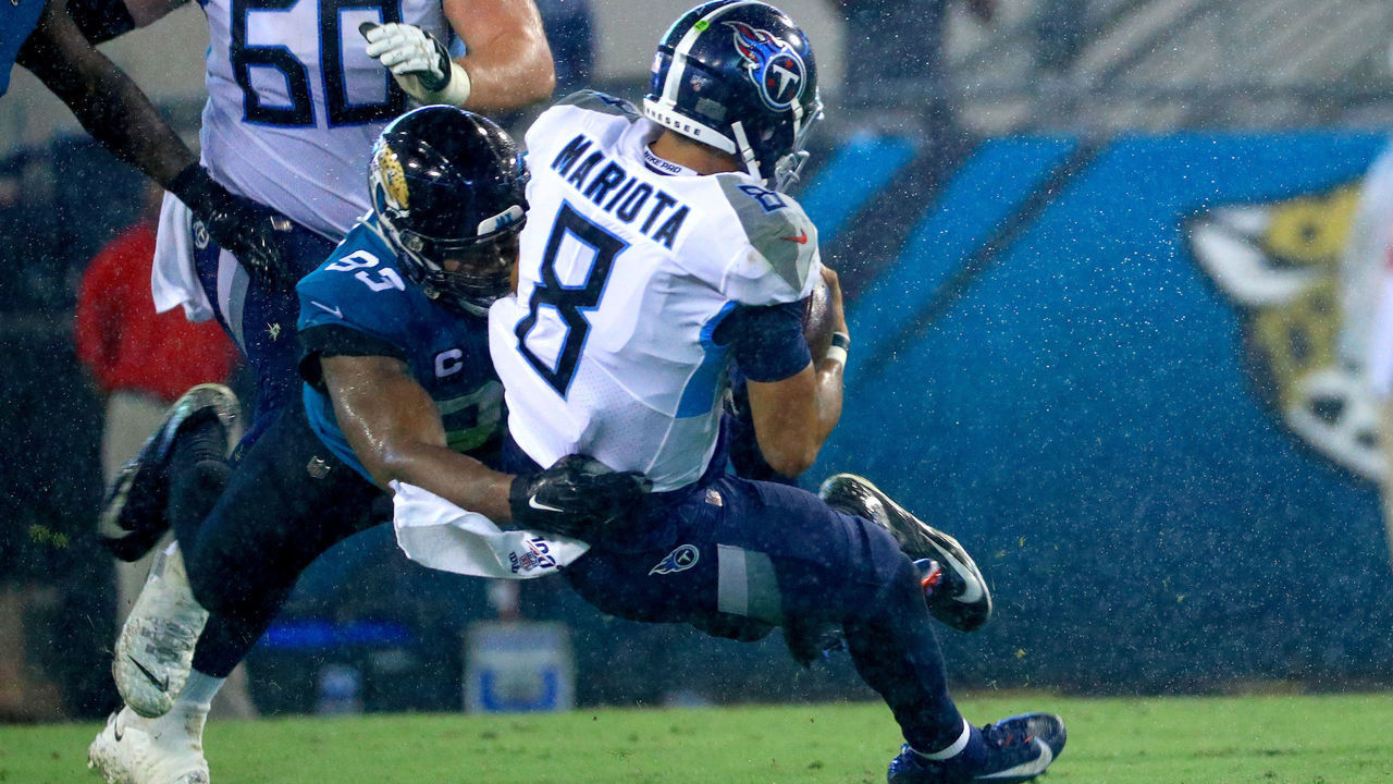 JACKSONVILLE, FLORIDA - SEPTEMBER 19: Marcus Mariota #8 of the Tennessee Titans is tackled by Calais Campbell #93 of the Jacksonville Jaguars during a game at TIAA Bank Field on September 19, 2019 in Jacksonville, Florida.