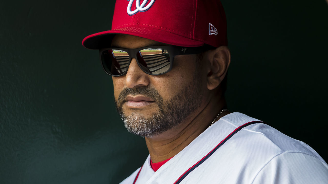 WASHINGTON, DC - JULY 24: Manager Dave Martinez #4 of the Washington Nationals looks on against the Colorado Rockies during the third inning of game one of a doubleheader at Nationals Park on June 24, 2019 in Washington, DC.