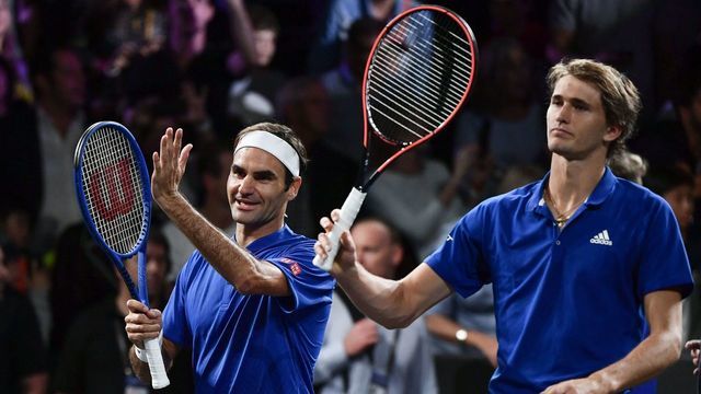 Team Europe's Roger Federer (L) and Alexander Zverev celebrate their victory over Team World's Denis Shapovalov and Jack Sock during their double match as part of the 2019 Laver Cup tennis tournament in Geneva, on September 20, 2019.