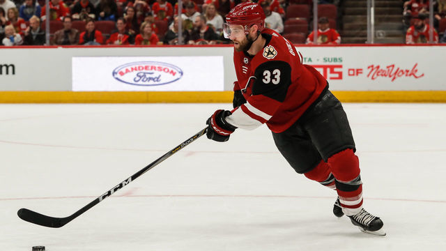 GLENDALE, AZ - MARCH 26: Arizona Coyotes defenseman Alex Goligoski (33) skates with the puck during the NHL hockey game between the Chicago Blackhawks and the Arizona Coyotes on March 26, 2019 at Gila River Arena in Glendale, Arizona.