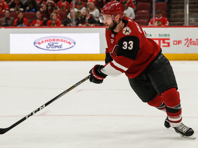 GLENDALE, AZ - MARCH 26: Arizona Coyotes defenseman Alex Goligoski (33) skates with the puck during the NHL hockey game between the Chicago Blackhawks and the Arizona Coyotes on March 26, 2019 at Gila River Arena in Glendale, Arizona.