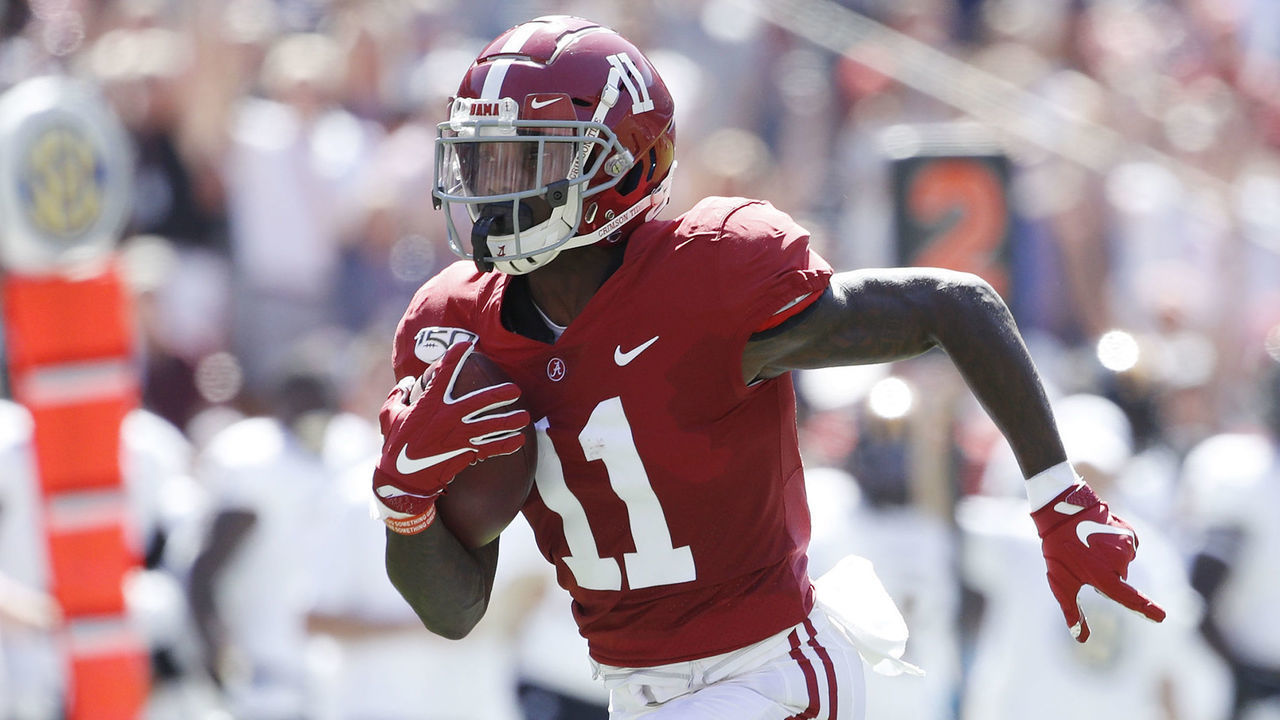 TUSCALOOSA, AL - SEPTEMBER 21: Henry Ruggs III #11 of the Alabama Crimson Tide runs for a 45-yard touchdown in the first quarter after catching a pass behind D.Q. Thomas #12 of the Southern Mississippi Golden Eagles at Bryant-Denny Stadium on September 21, 2019 in Tuscaloosa, Alabama.