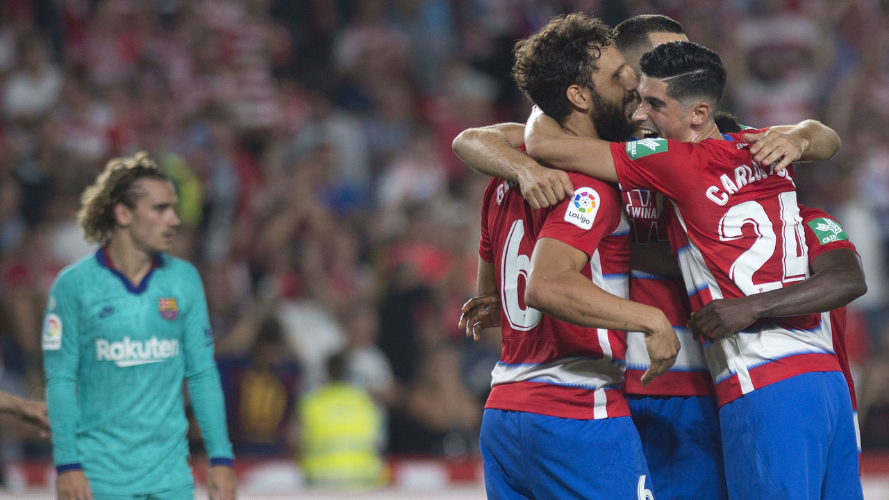 Granada's players celebrate their win at the end of the Spanish league football match between Granada FC and FC Barcelona at Nuevo Los Carmenes stadium in Granada on September 21, 2019.