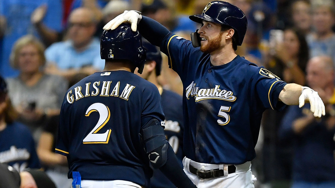 MILWAUKEE, WISCONSIN - SEPTEMBER 21: Cory Spangenberg #5 of the Milwaukee Brewers congratulates Trent Grisham #2 of the Milwaukee Brewers for his two run home run in the seventh inning against the Pittsburgh Pirates at Miller Park on September 21, 2019 in Milwaukee, Wisconsin.