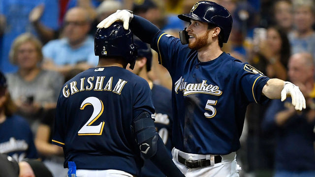 MILWAUKEE, WISCONSIN - SEPTEMBER 21: Cory Spangenberg #5 of the Milwaukee Brewers congratulates Trent Grisham #2 of the Milwaukee Brewers for his two run home run in the seventh inning against the Pittsburgh Pirates at Miller Park on September 21, 2019 in Milwaukee, Wisconsin.