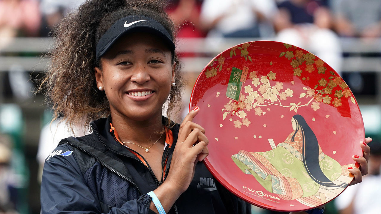 OSAKA, JAPAN - SEPTEMBER 22: Singles champion Naomi Osaka of Japan poses for photographs with the trophy after the Singles final agains Anastasia Pavlyuchenkova of Russia during day seven of the Toray Pan Pacific Open at Utsubo Tennis Cent on September 22, 2019 in Osaka, Japan.