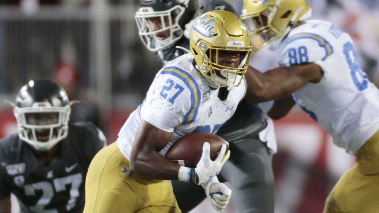 PULLMAN, WASHINGTON - SEPTEMBER 21: Joshua Kelley #27 of the UCLA Bruins carries the ball against the Washington State Cougars in the second half at Martin Stadium on September 21, 2019 in Pullman, Washington. UCLA defeats Washington State 67-63.
