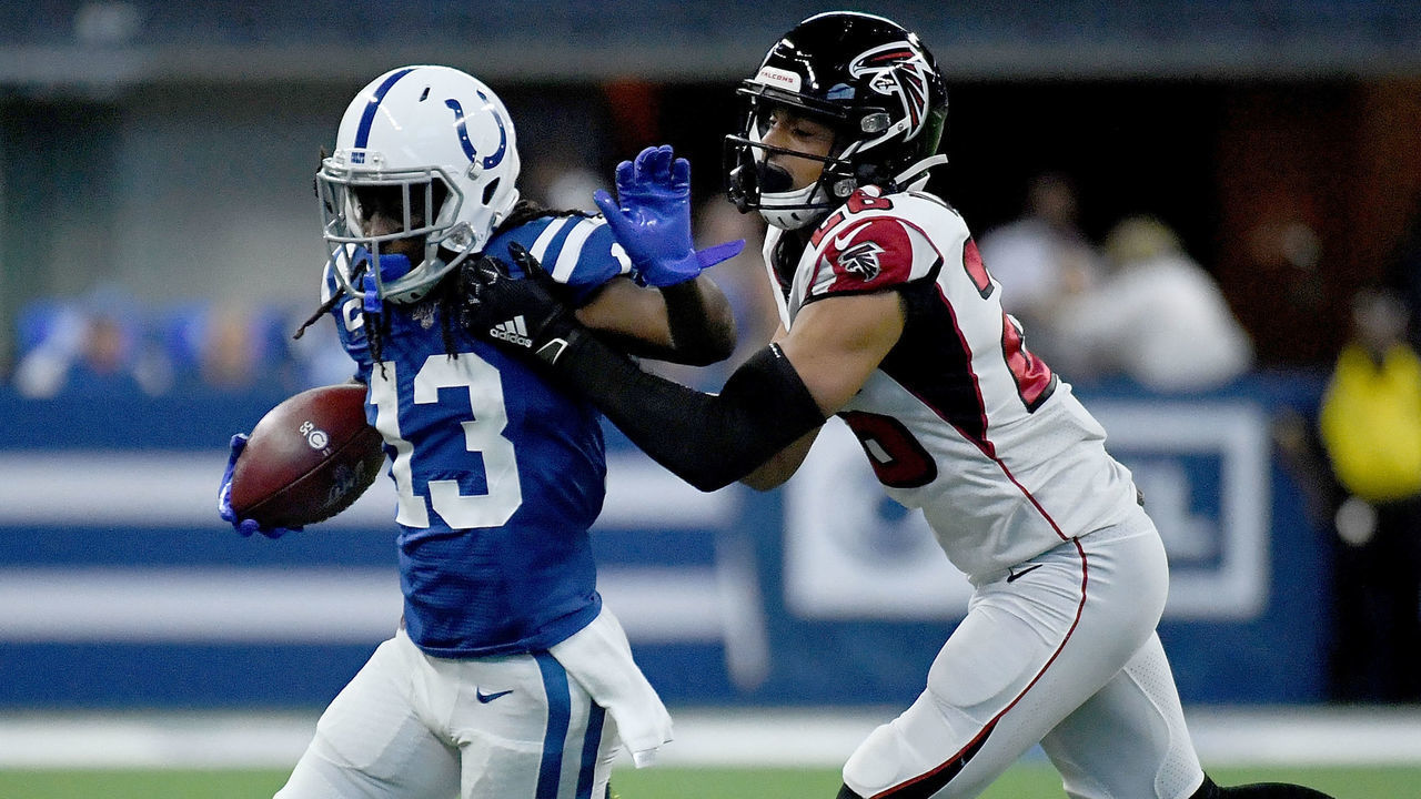 INDIANAPOLIS, IN - SEPTEMBER 22: T.Y. Hilton #13 of the Indianapolis Colts stiff arms Isaiah Oliver #26 of the Atlanta Falcons after making a catch in the first quarter of the game at Lucas Oil Stadium on September 22, 2019 in Indianapolis, Indiana.