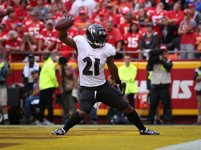 KANSAS CITY, MO - SEPTEMBER 22: Baltimore Ravens running back Mark Ingram (21) spikes the ball to celebrate his 2-yard touchdown run in the first quarter of an AFC matchup between the Baltimore Ravens and Kansas City Chiefs on September 22, 2019 at Arrowhead Stadium in Kansas City, MO.