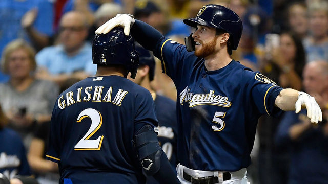 MILWAUKEE, WISCONSIN - SEPTEMBER 21: Cory Spangenberg #5 of the Milwaukee Brewers congratulates Trent Grisham #2 of the Milwaukee Brewers for his two run home run in the seventh inning against the Pittsburgh Pirates at Miller Park on September 21, 2019 in Milwaukee, Wisconsin.