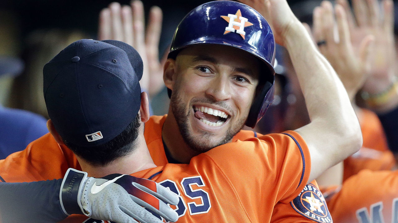 HOUSTON, TEXAS - SEPTEMBER 22: George Springer #4 of the Houston Astros celebrates with Garrett Stubbs #11 after hitting a two-run home run in the second inning against the Los Angeles Angels at Minute Maid Park on September 22, 2019 in Houston, Texas.
