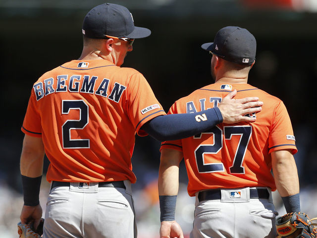 NEW YORK, NEW YORK - JUNE 23: Alex Bregman #2 and Jose Altuve #27 of the Houston Astros in action against the New York Yankees at Yankee Stadium on June 23, 2019 in New York City. The Astros defeated the Yankees 9-4.
