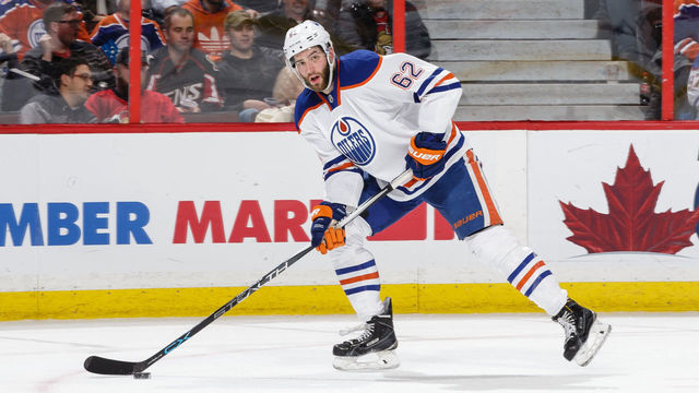 OTTAWA, ON - FEBRUARY 4: Eric Gryba #62 of the Edmonton Oilers skates with the puck against the Ottawa Senators during an NHL game at Canadian Tire Centre on February 4, 2016 in Ottawa, Ontario, Canada.