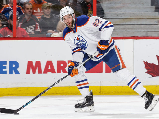 OTTAWA, ON - FEBRUARY 4: Eric Gryba #62 of the Edmonton Oilers skates with the puck against the Ottawa Senators during an NHL game at Canadian Tire Centre on February 4, 2016 in Ottawa, Ontario, Canada.