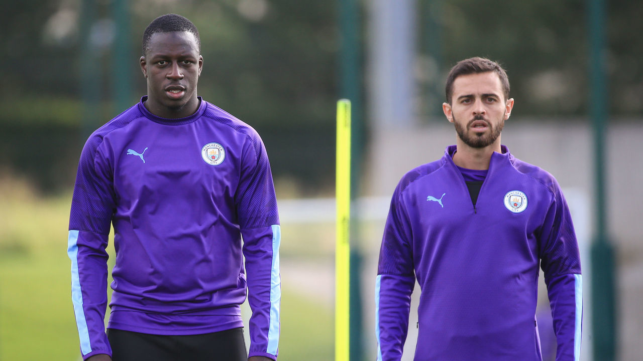 MANCHESTER, ENGLAND - SEPTEMBER 13: Manchester City's Benjamin Mendy and Bernardo Silva in action during training at Manchester City Football Academy on September 13, 2019 in Manchester, England.