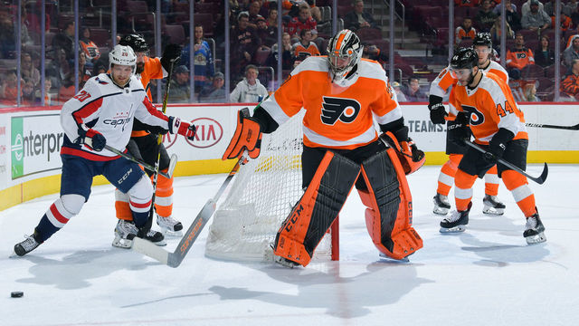 PHILADELPHIA, PENNSYLVANIA - MARCH 14: Carter Hart #79 of the Philadelphia Flyers clears away the puck against the Washington Capitals in the third period at Wells Fargo Center on March 14, 2019 in Philadelphia, Pennsylvania. The Capitals won 5-2.
